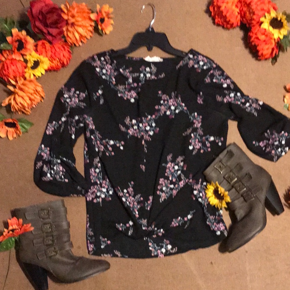 Floral blouse with a knot in the front